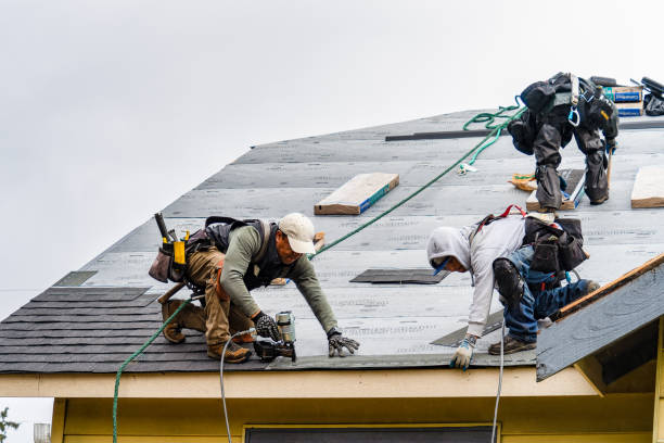 Professional Roofing technician working in Framingham, MA